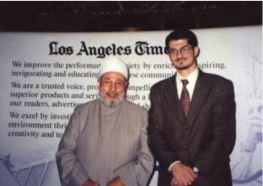 Hussam Ayloush posing with the Muslim Brotherhood's Sheikh Youssef al Qaradawi. It is worth noting that Qaradawi has been banned from traveling to the US, the UK and France for his ties to "extremism." He has also endorsed female genital mutilation and approved Jihadists fighting the US in Iraq and attacking civilians in Israel